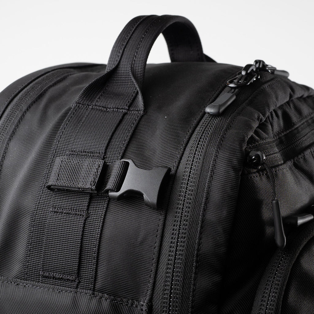 Alpha One Niner EVADE 1.5 Gen 2 25L backpack, top grab handle and compression strap detail