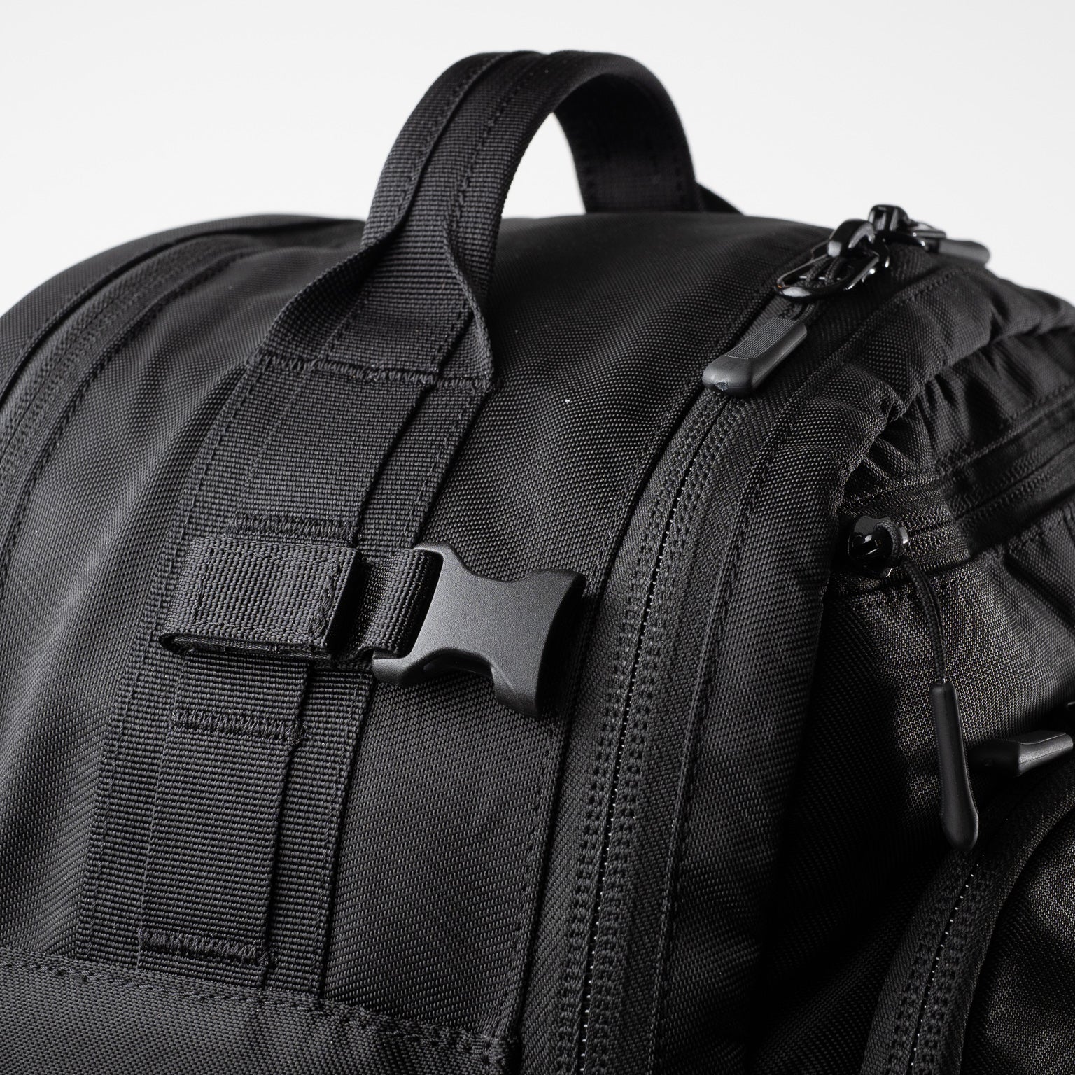 Alpha One Niner EVADE 1.5 Gen 2 25L backpack, top grab handle and compression strap detail